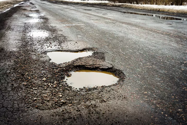 Potholes on a road